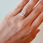 Gold ring with a large lab grown emerald cut diamond on a lady's hand at LeGassick, Gold Coast, Australia.