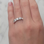 Gold ring with five lab created diamonds on a lady's hand at LeGassick, Gold Coast, Australia.