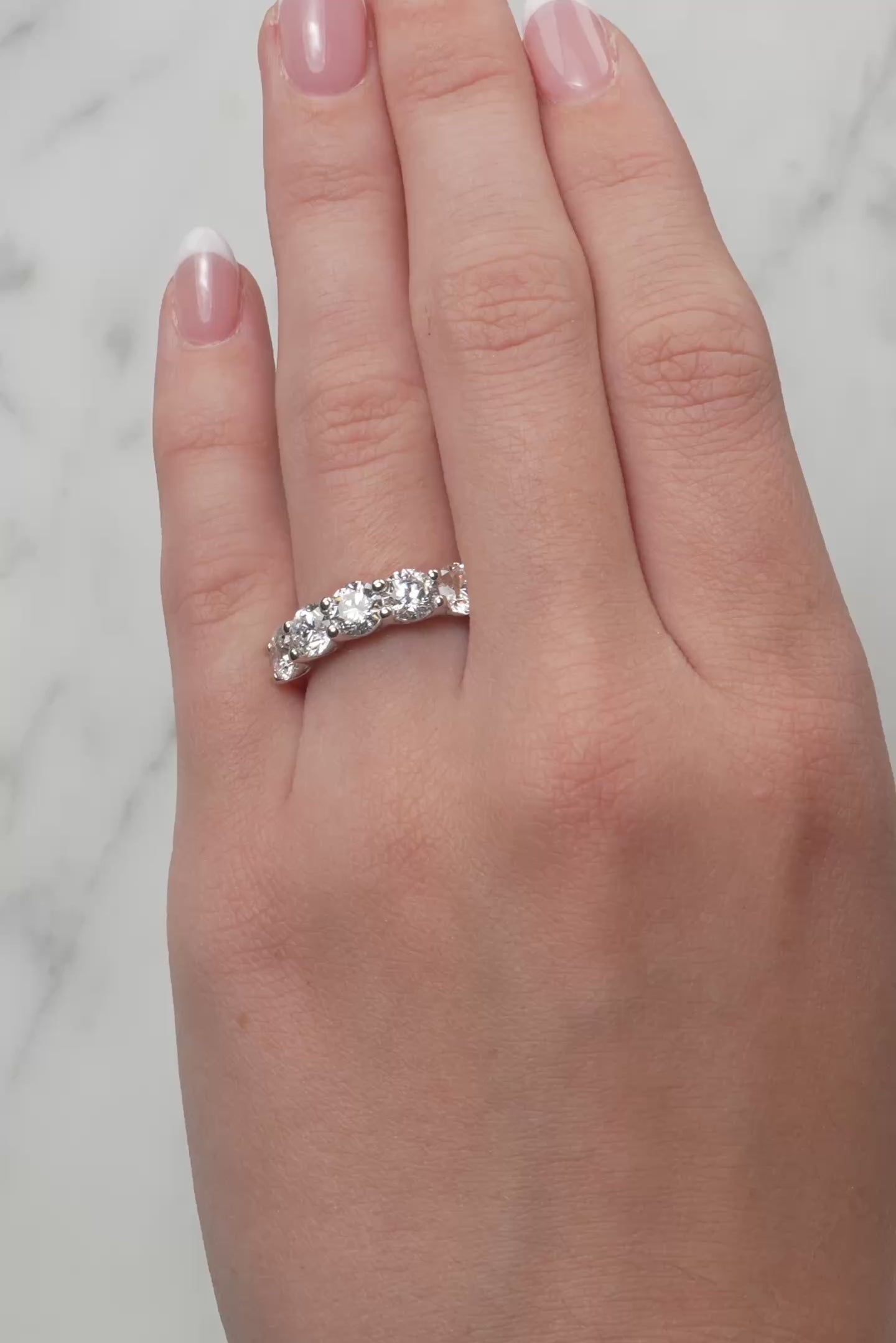 Gold ring with five lab created diamonds on a lady's hand at LeGassick, Gold Coast, Australia.