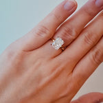 Gold ring with a lab diamond on a hand against a neutral background at LeGassick.