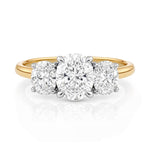 Gold ring with three lab grown diamonds on a white background