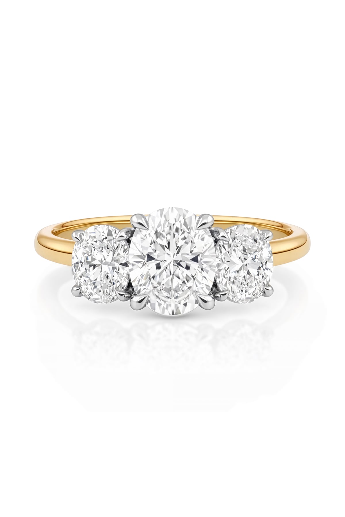 Gold ring with three lab grown diamonds on a white background