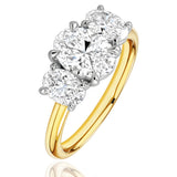 Gold ring with three lab grown diamonds on a white background