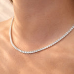 Close-up of a lab diamond collier necklace on a person's neck at LeGassick.