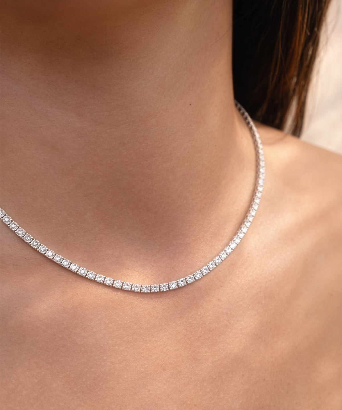 Close-up of a lab diamond collier necklace on a person's neck at LeGassick.