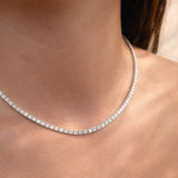 Close-up of a lab diamond collier necklace on a person's neck at LeGassick.
