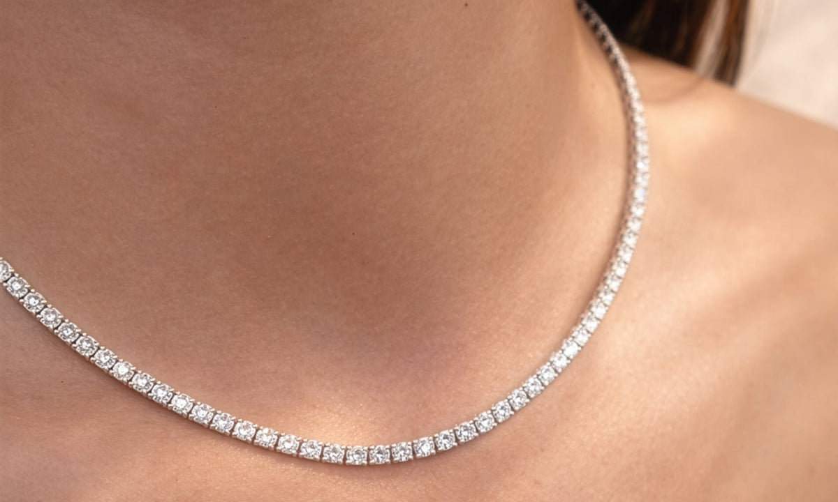 Close-up of a lab diamond collier necklace on a person's neck at LeGassick.