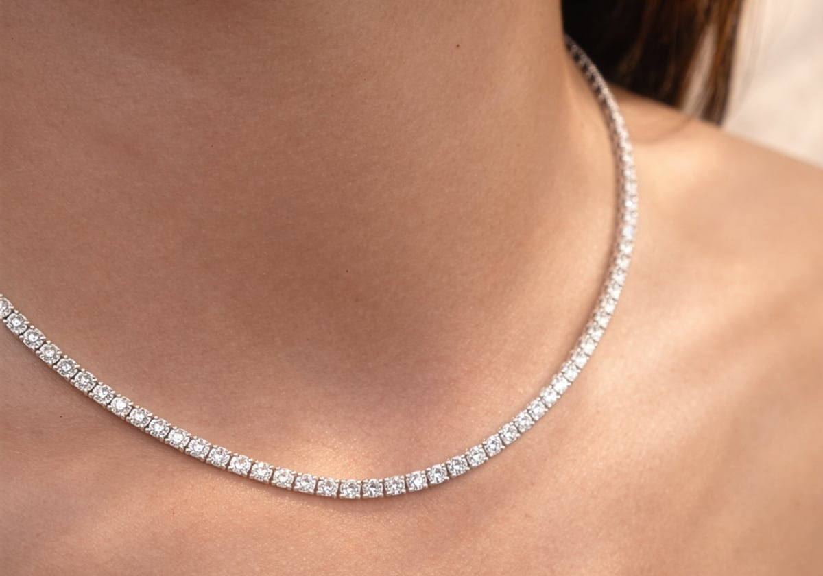 Close-up of a lab diamond collier necklace on a person's neck at LeGassick.